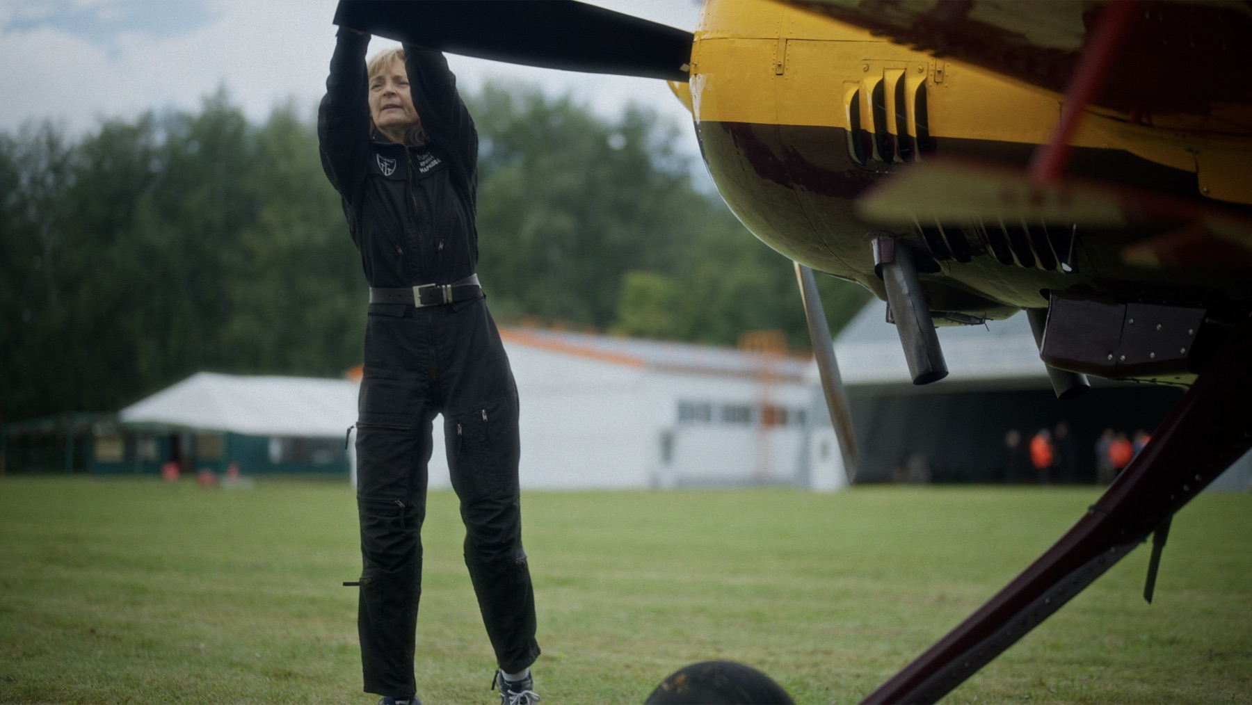 Irina Markova beside a yellow aircraft